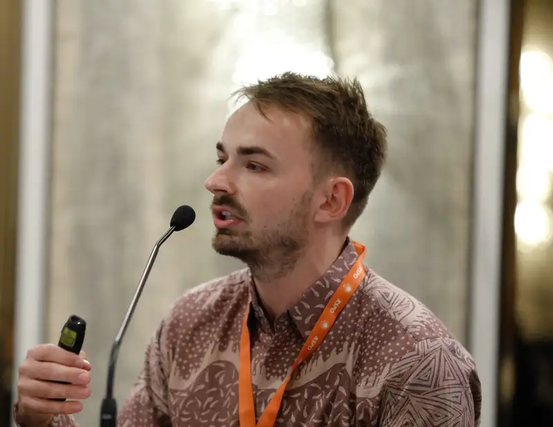 Luca Fischer speaking on a panel
